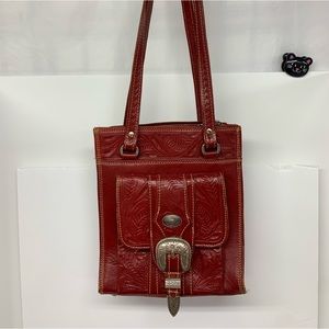 Used dark red tooled leather bag
